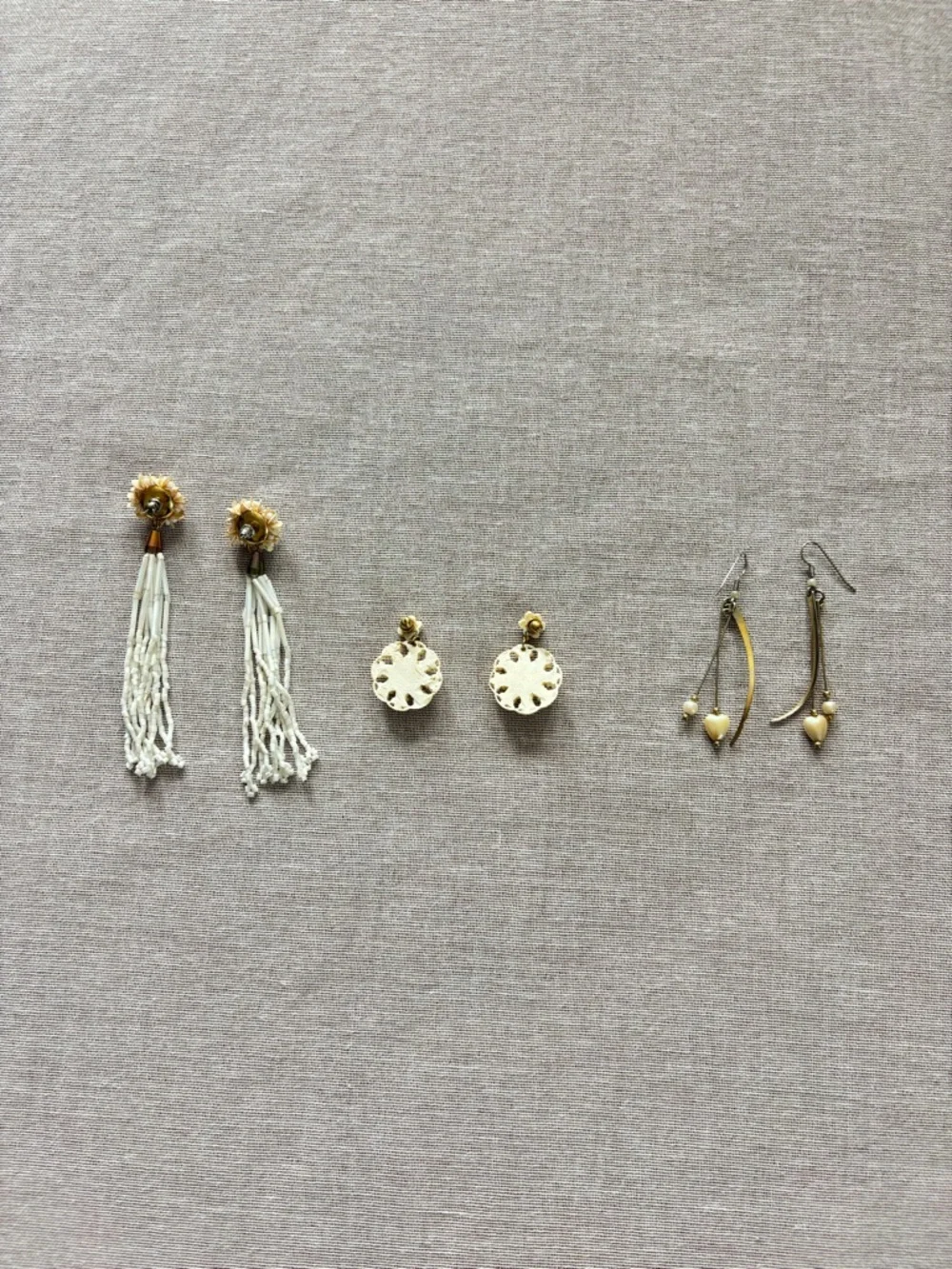 Set of three vintage cream earrings.
